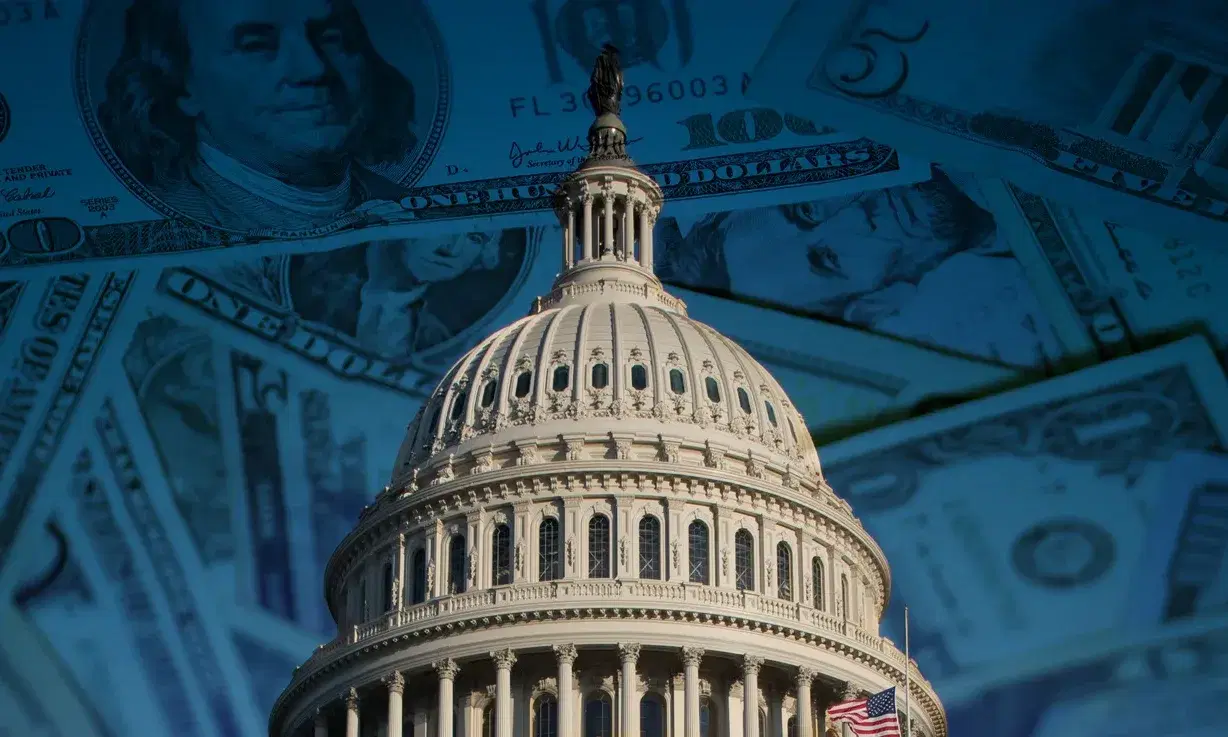 Photo of US Capital on top of a pile of money