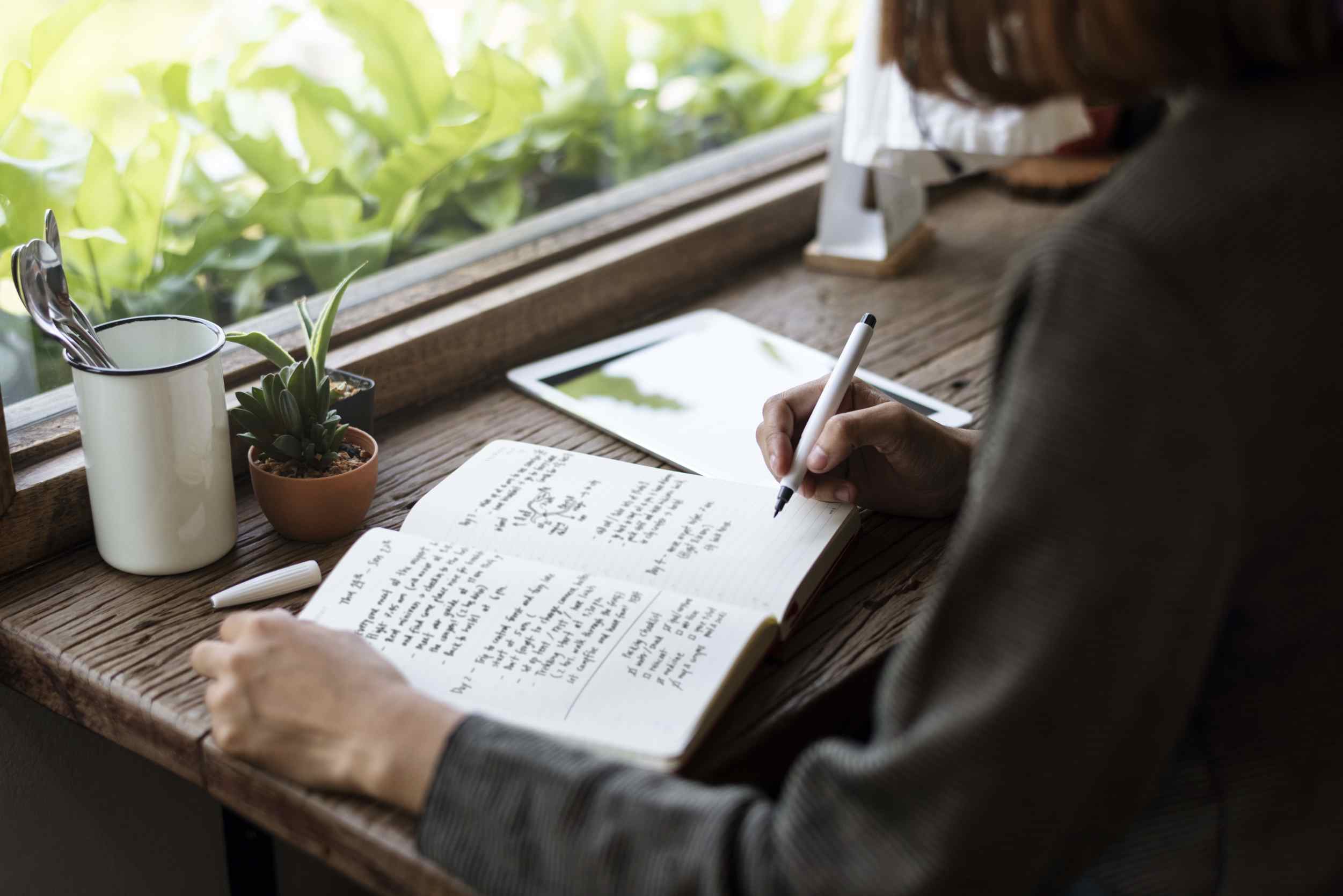 Women writing in her journal