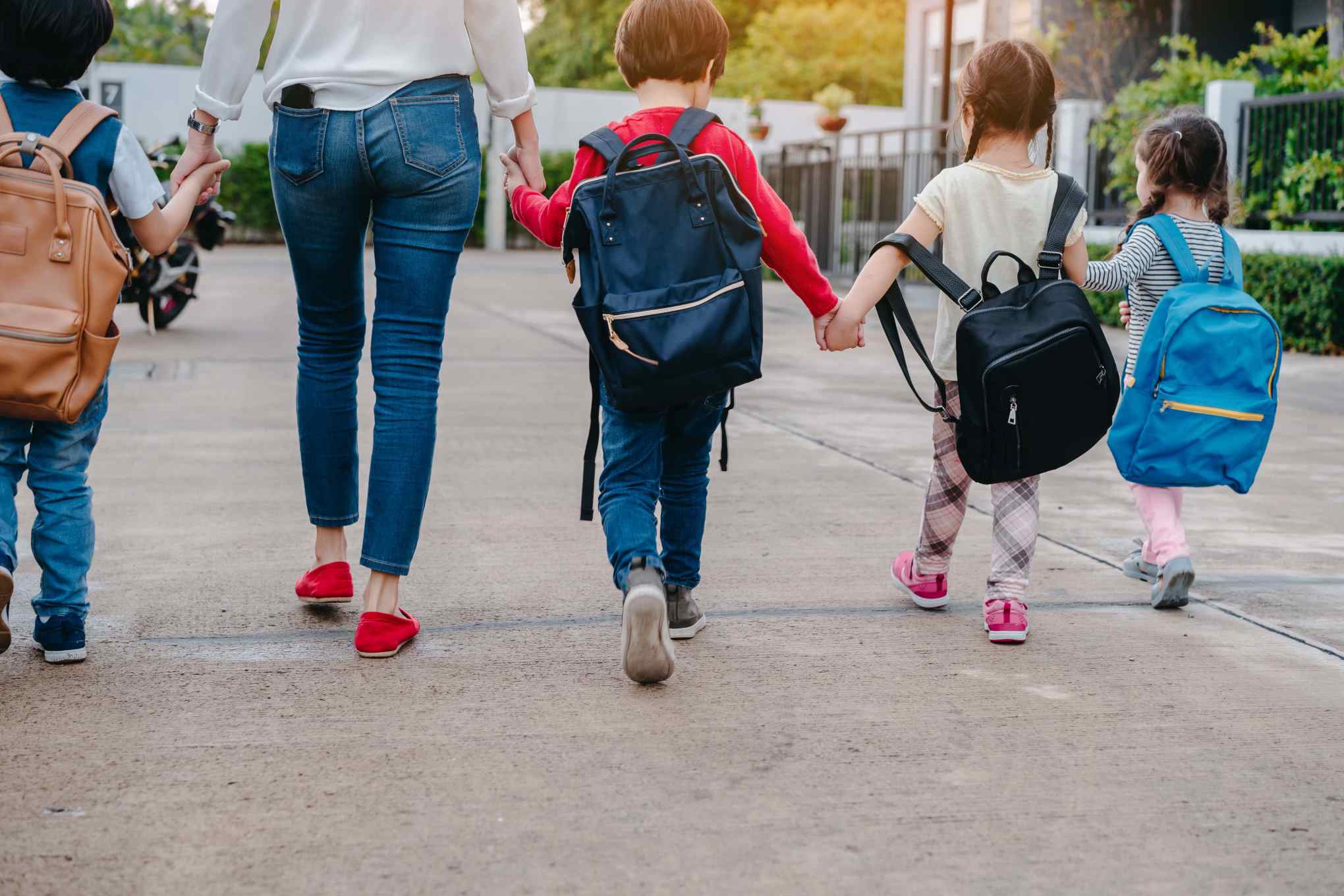 kids walking hand in hand